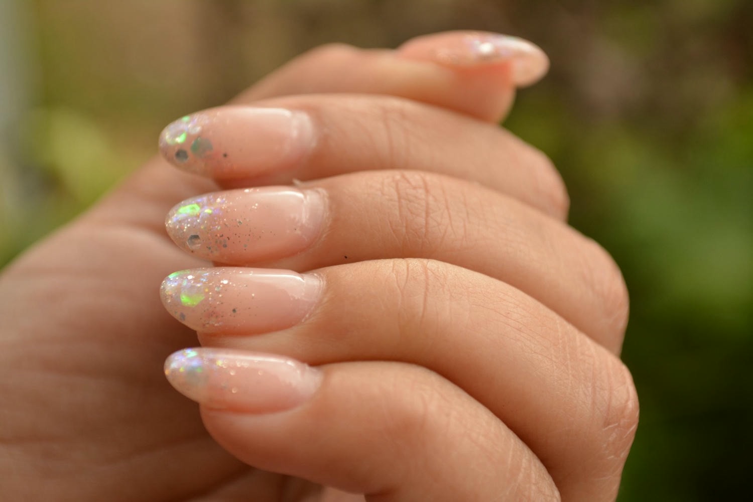 a woman's hand with a manicured nail polish