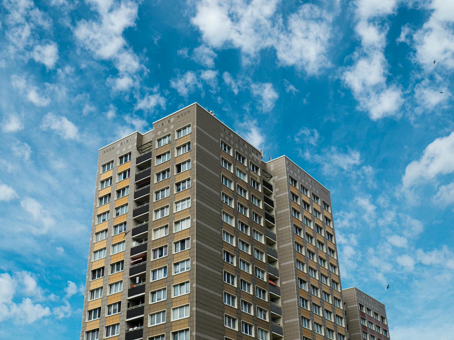 white and blue concrete building under blue sky during daytime