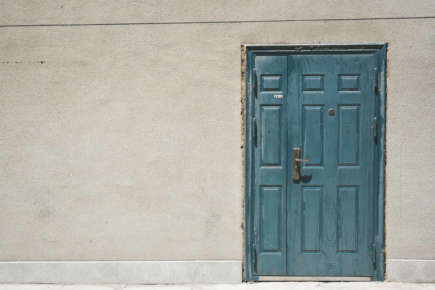 closed door and white painted wall